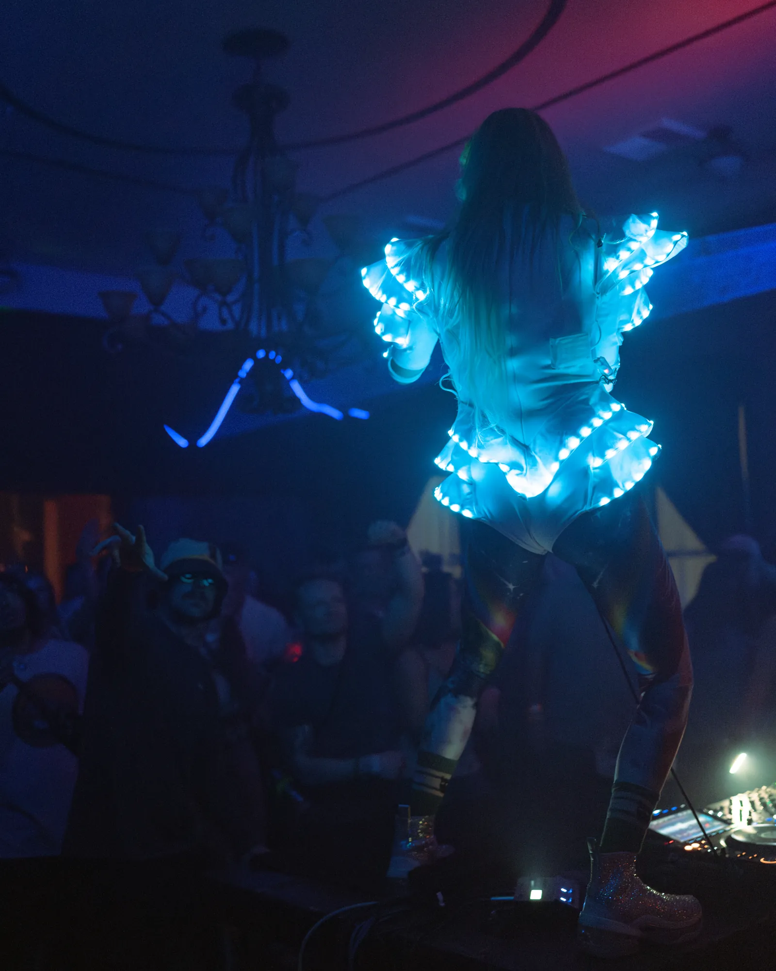 Performer surrounded by blue light